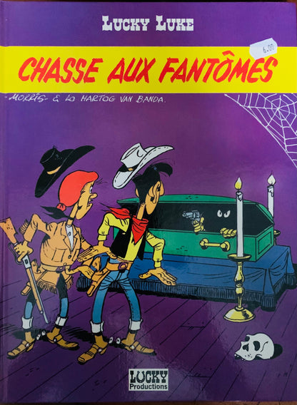 Purple comic book cover of lucky luke series bd mix featuring two cowboys by a green coffin