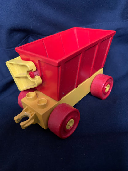 Red plastic dump truck with yellow chassis red wheels and detachable front loader toy for imaginative play