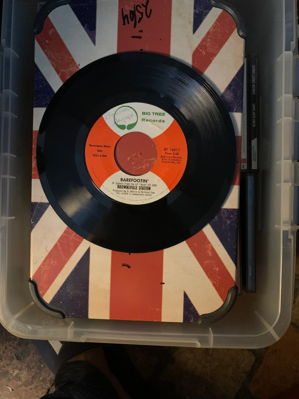Black vinyl record with orange and white big tree records label featuring barefootin by brownsville station soul 7 single
