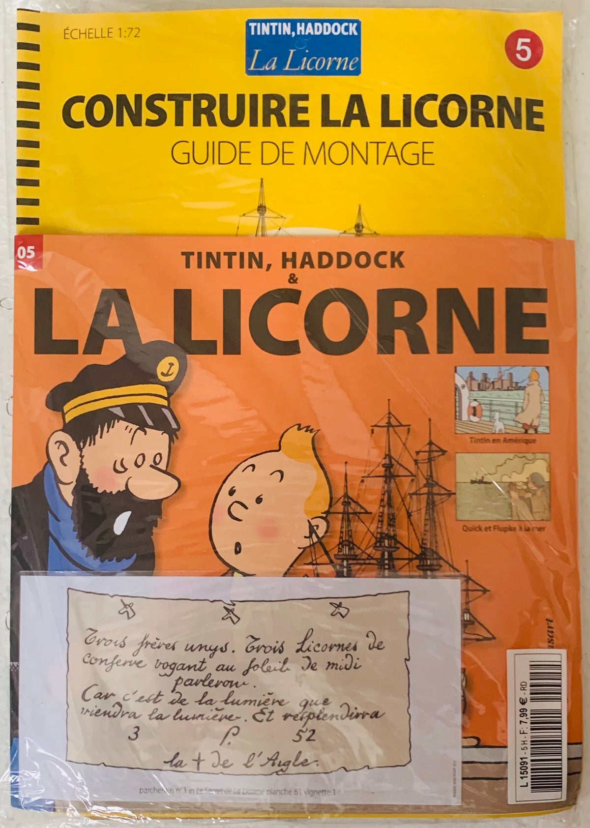 Yellow and orange booklet with tintin and haddock on the cover featuring a la licorne model kit guide at scale 1 72