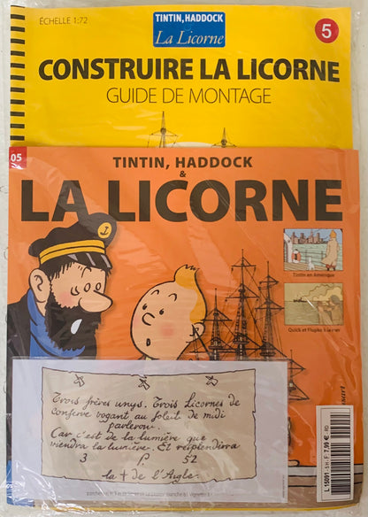 Yellow and orange booklet with tintin and haddock on the cover featuring a la licorne model kit guide at scale 1 72