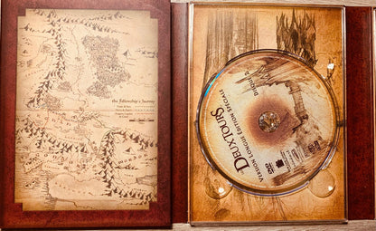 The fellowship’s journey map cd case with sepia shire and mordor illustration in the lord of the rings extended collector’s edition 4-dvd box set