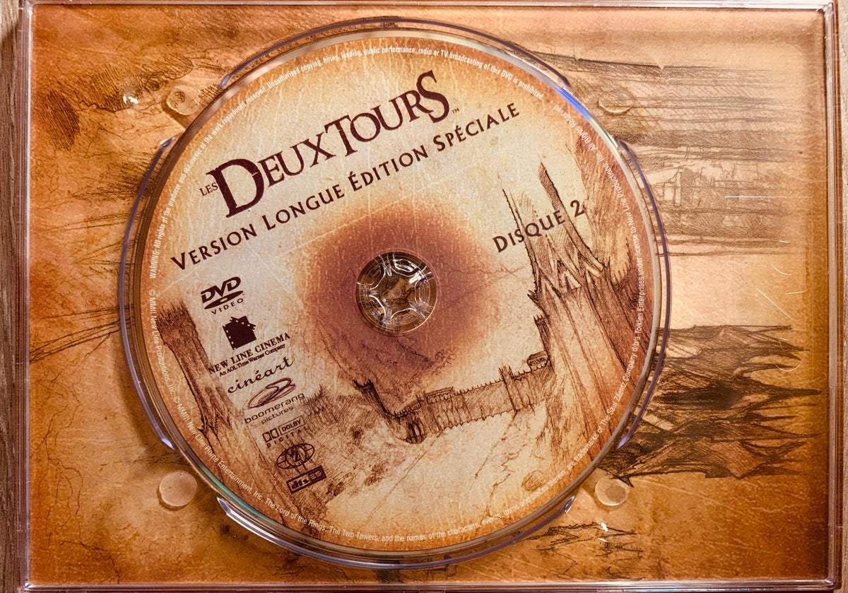 Vintage-style dvd disc with sepia medieval architecture labeled les deux tours disc 2 in the lord of the rings extended edition