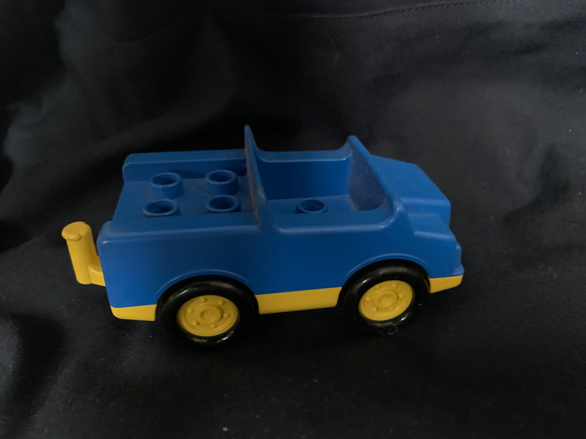 Blue and yellow plastic toy truck with a convertible top from Toys 001 for children’s play