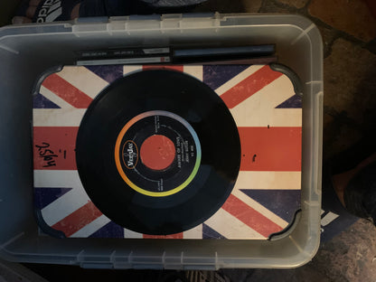 Black vinyl record soul 7 with colorful verjay label resting on union jack themed surface