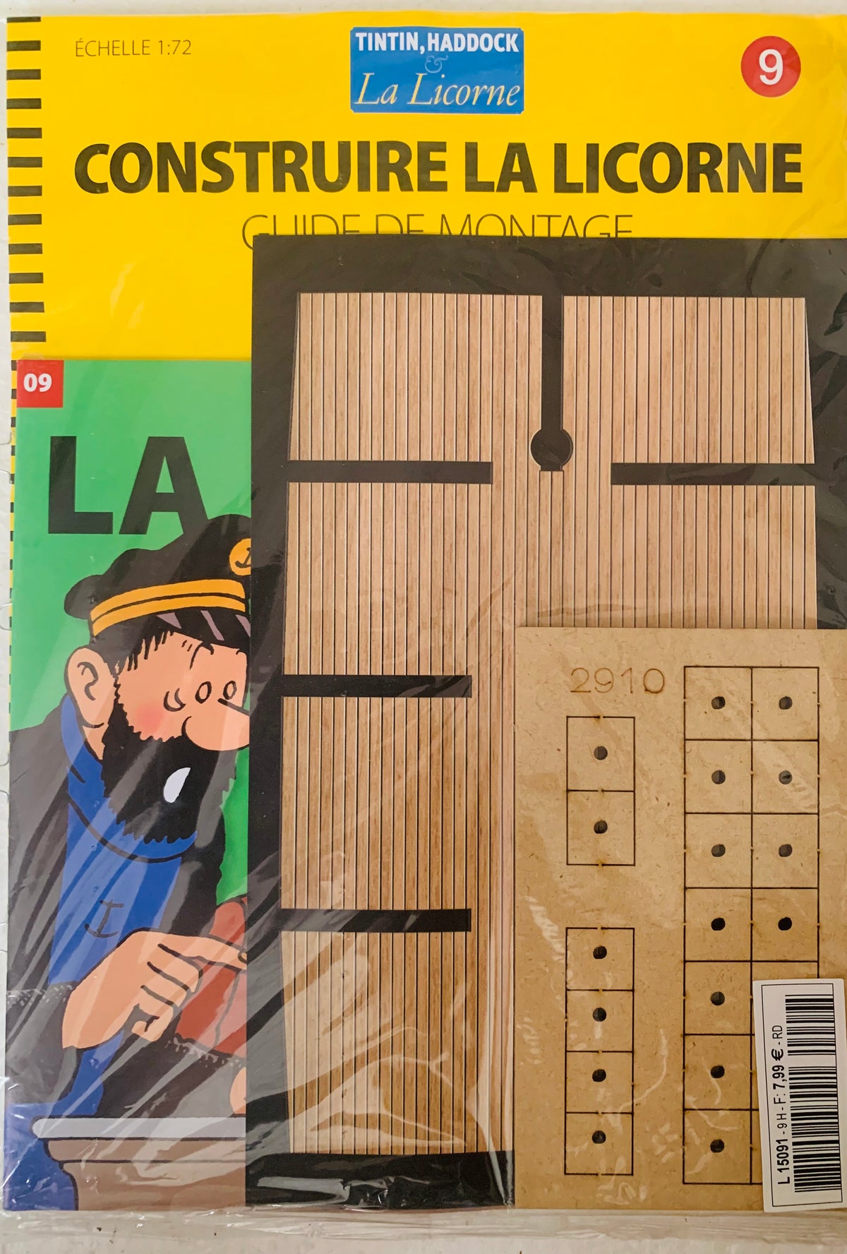 Yellow and green cardboard packaging for tintin and haddock la licorne wooden ship model kit featuring captain haddock illustration