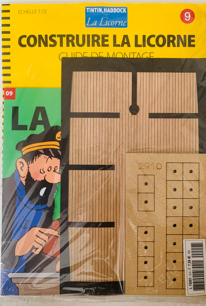 Yellow and green cardboard packaging for tintin and haddock la licorne wooden ship model kit featuring captain haddock illustration