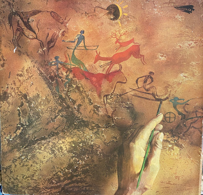The moody blues album cover shows a hand with a green brush adding color to ancient cave paintings in earthy tones
