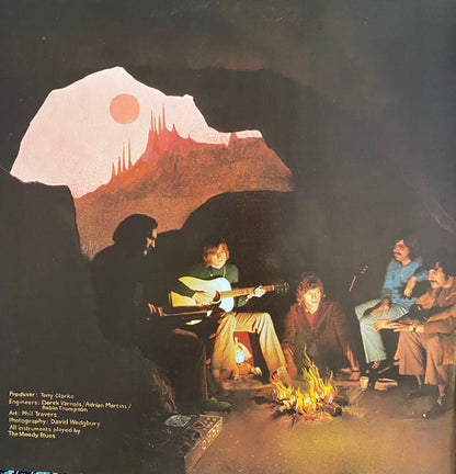 The moody blues to our childrens childrens children album cover features a surreal landscape with red and white mountains under an orange sun