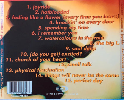 The back cover of the joyride cd by natalie and joyride features a fiery orange and black design with track listings