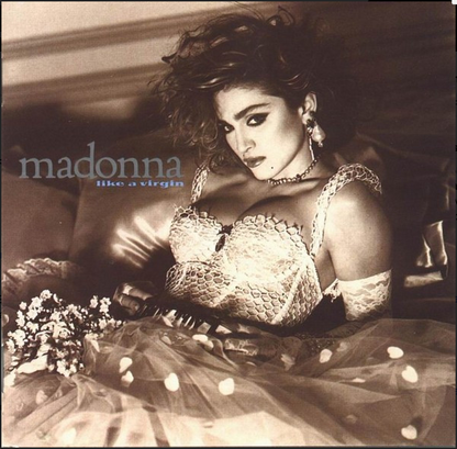 Madonna like a virgin cd album cover featuring Madonna wearing a white lace bra and matching sheer skirt