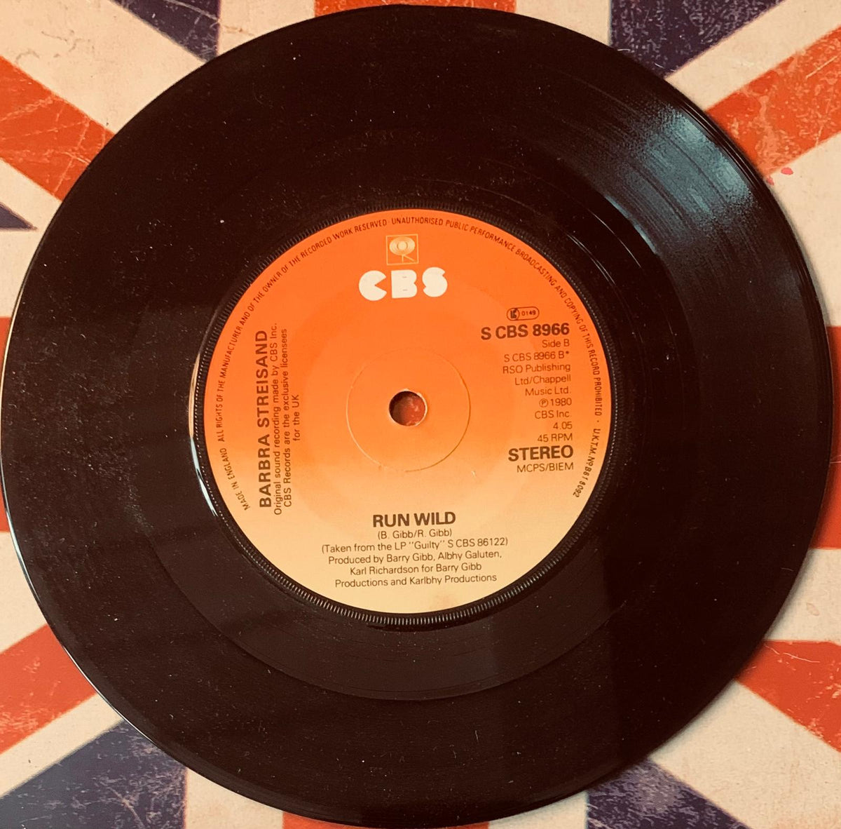 Black vinyl record with orange cbs label featuring track run wild by barbra streisand original 45t vinyl