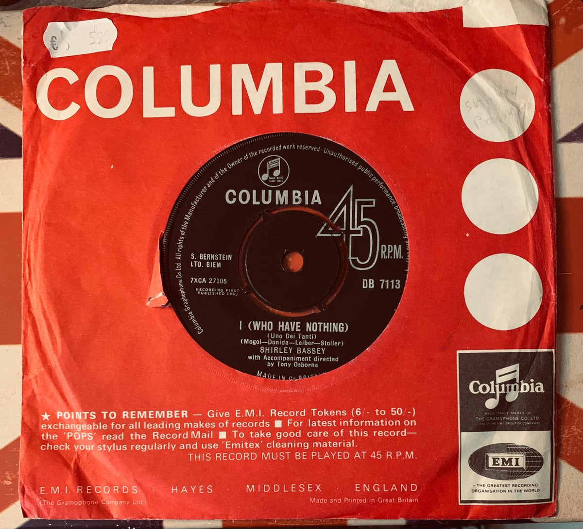 Red columbia 45 rpm vinyl record sleeve with black record white text and columbia logo for shirley bassey single
