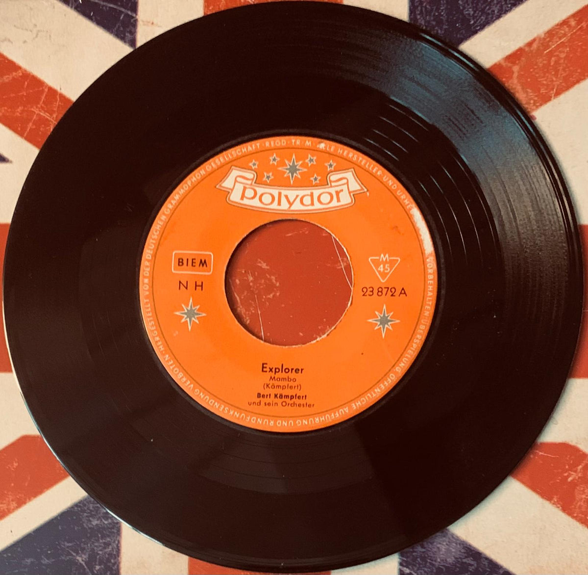 Black vinyl record with orange polydor label featuring explorer by bert kämpferl from original 45t explorer vinyl