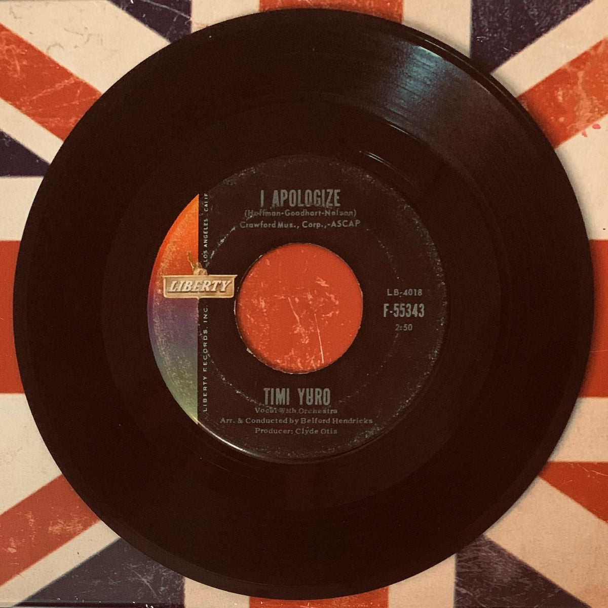 Black vinyl record with vibrant orange liberty records label featuring artist timi yuro for original 45t single