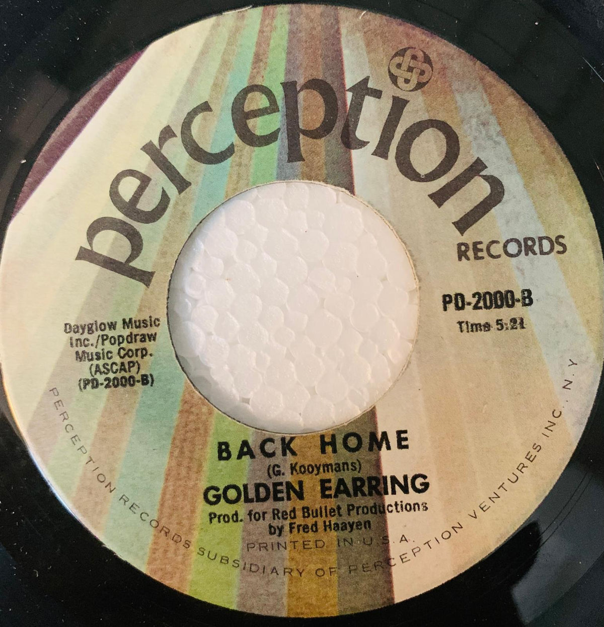 Vintage perception records 45 rpm vinyl single with colorful striped label featuring back home by golden earring