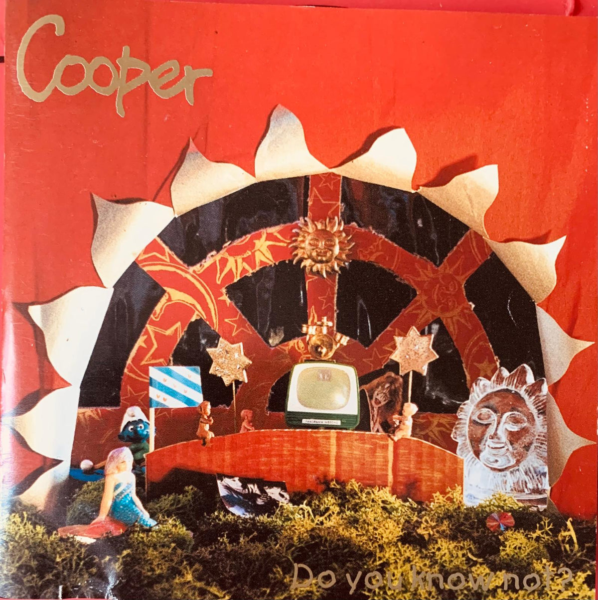 The album cover for cooper features a vibrant red background with paper cutout archway and miniature vintage television