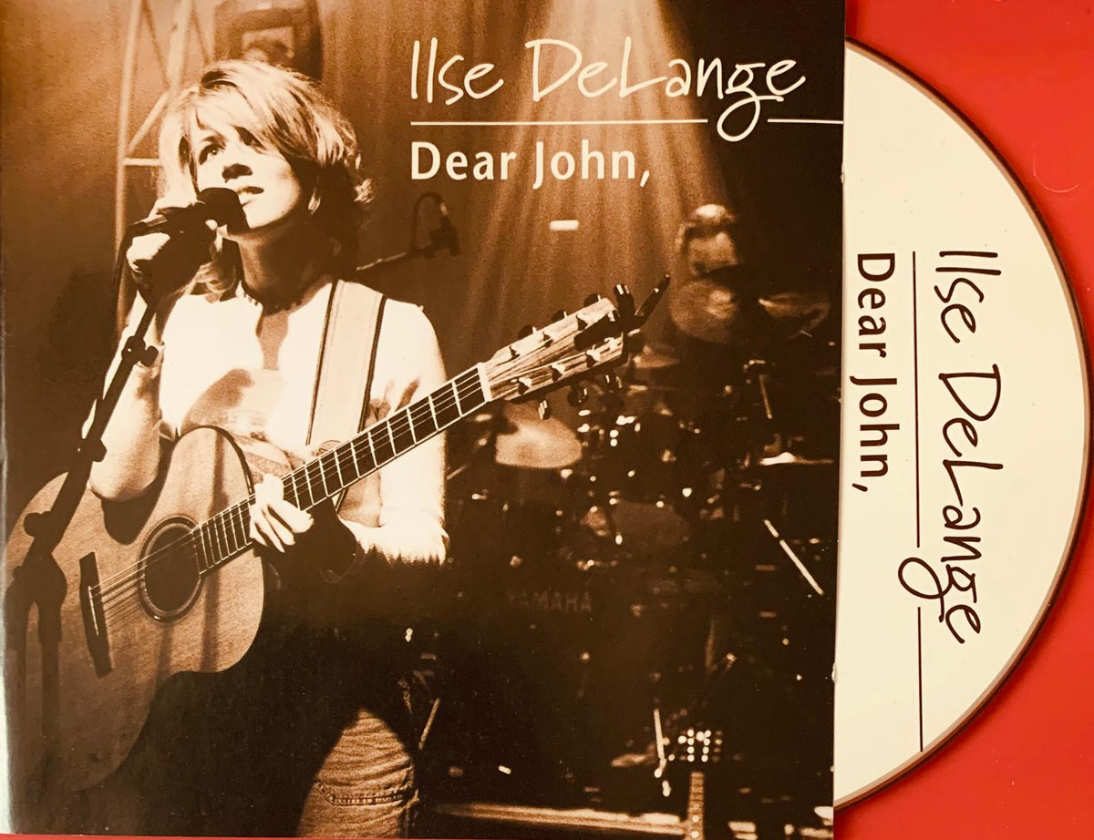 Sepia toned album cover of ilse delange dear john cd featuring woman singing with acoustic guitar alongside cd disc