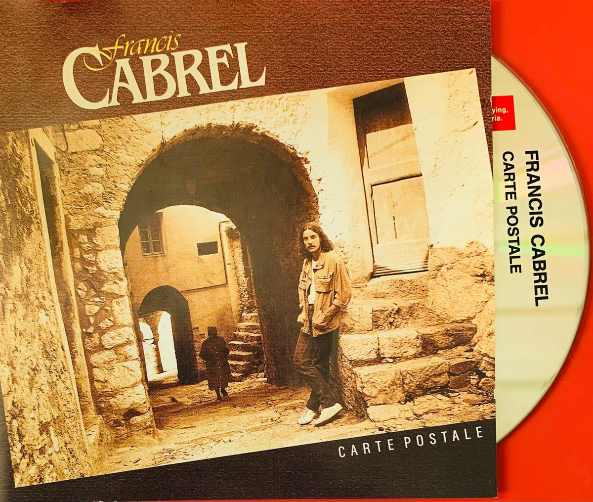 Francis Cabrel Carte Postale original CD album cover with sepia photo of artist in arched stone alleyway