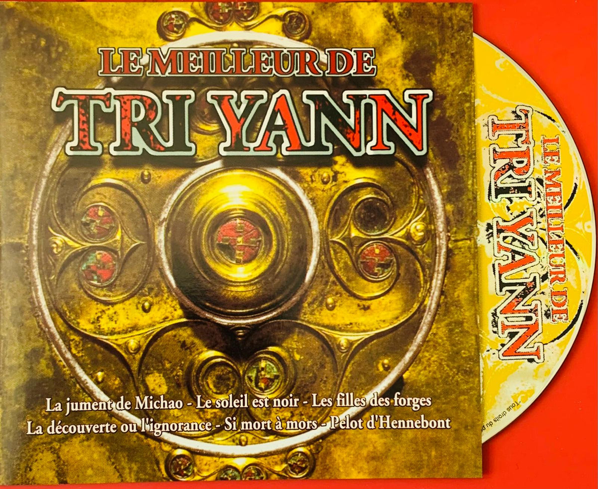 Golden ornate cd case with intricate circular metalwork and red text for tri yann le meilleur de tri yann album