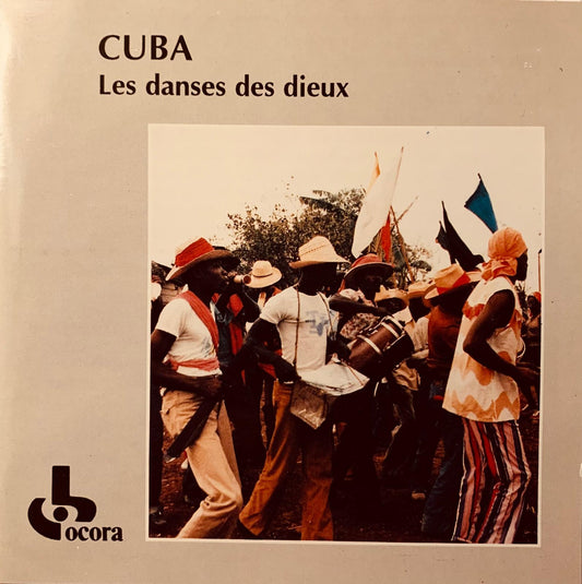 Album cover for cuba les danses des dieux cd featuring performers in traditional colorful hats and striped clothing