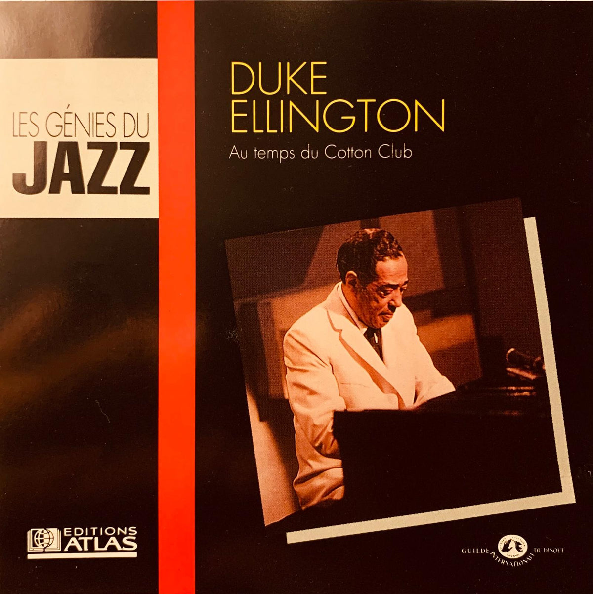 Black vinyl record album cover with sepia duke ellington in white suit playing piano gold lettering orange stripe