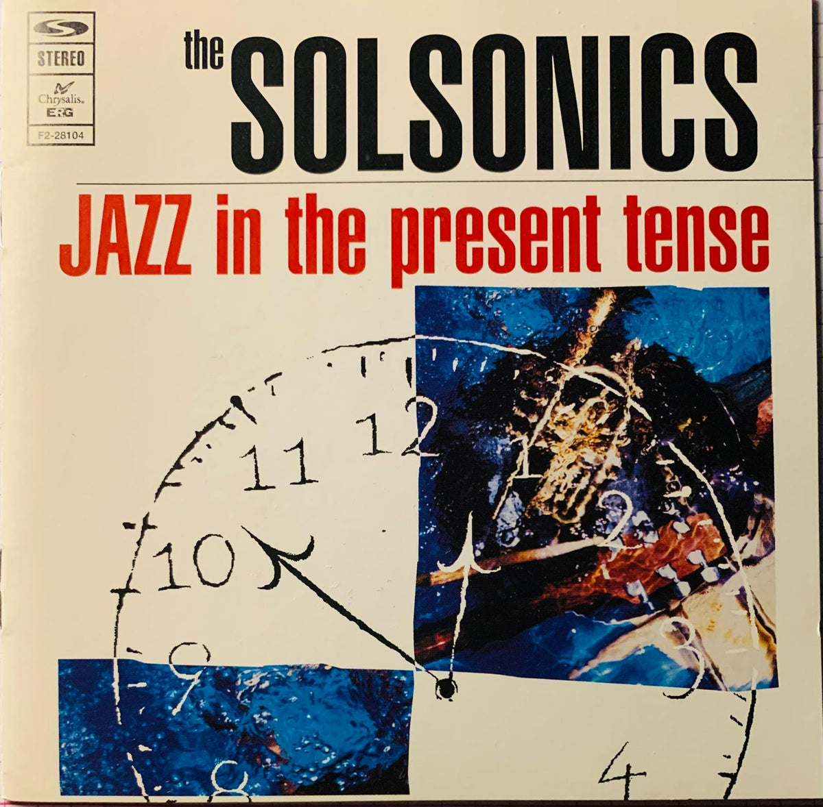 The album cover for The Solsonics Jazz In The Present Tense CD features a stylized clock face over abstract blue artwork