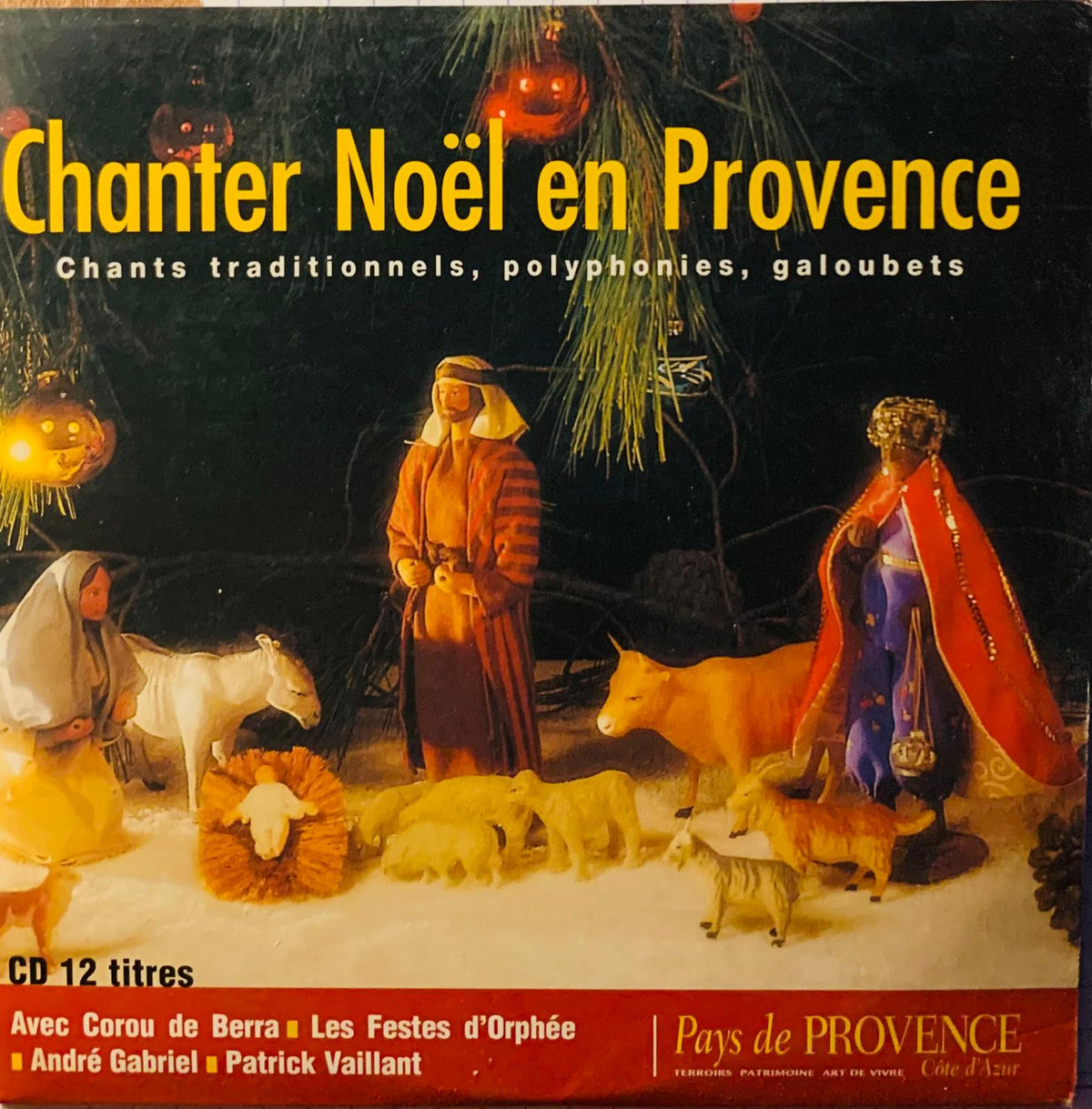 The album cover for Various Artists Chanter Noël En Provence cd shows a festive nativity scene with glowing jack-o-lanterns
