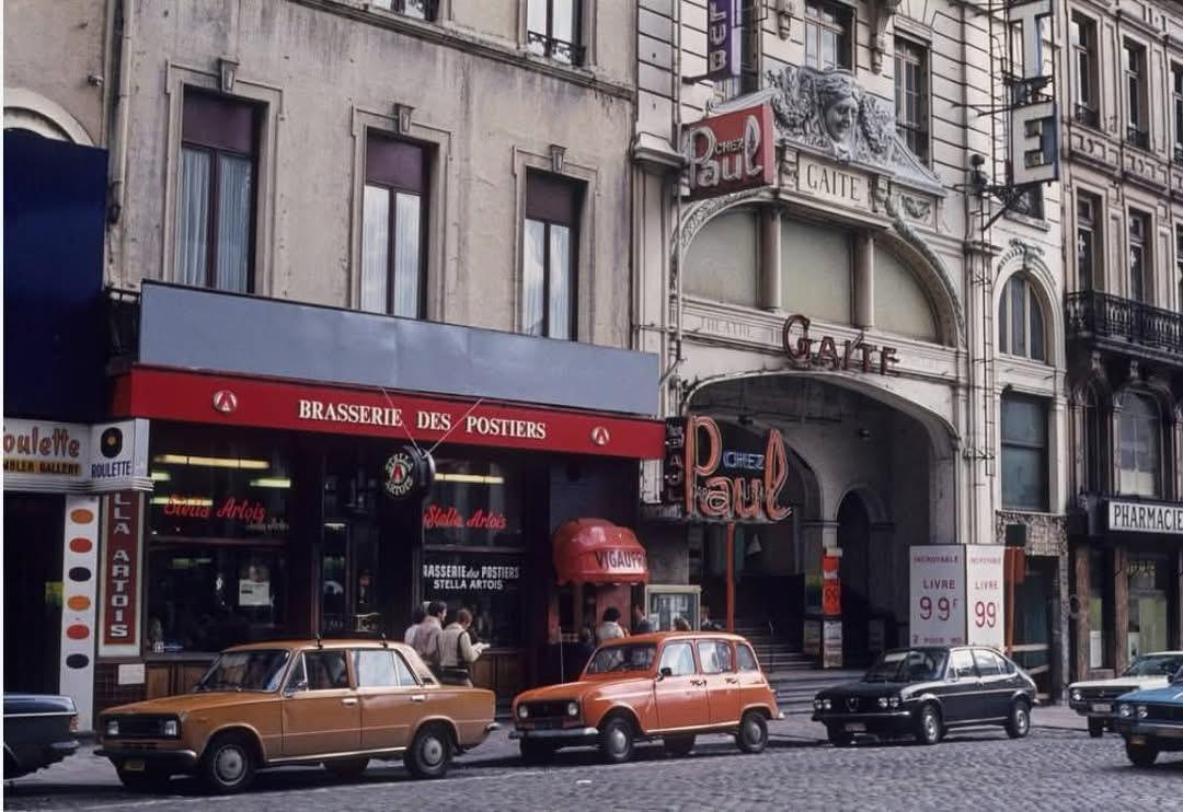 The original cd compilation paris features a vintage orange peugeot 204 with chrome details on a cobblestone street
