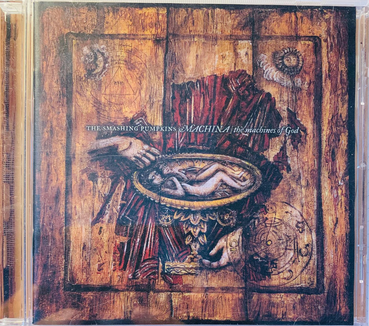The smashing pumpkins machina the machines of god cd album cover showing surreal hands holding an ornate bowl figure