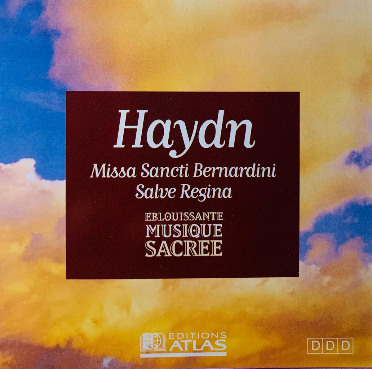 Dark brown cd album cover for various artists haydn missa sancti bernardini salve regina with orange yellow blue clouds