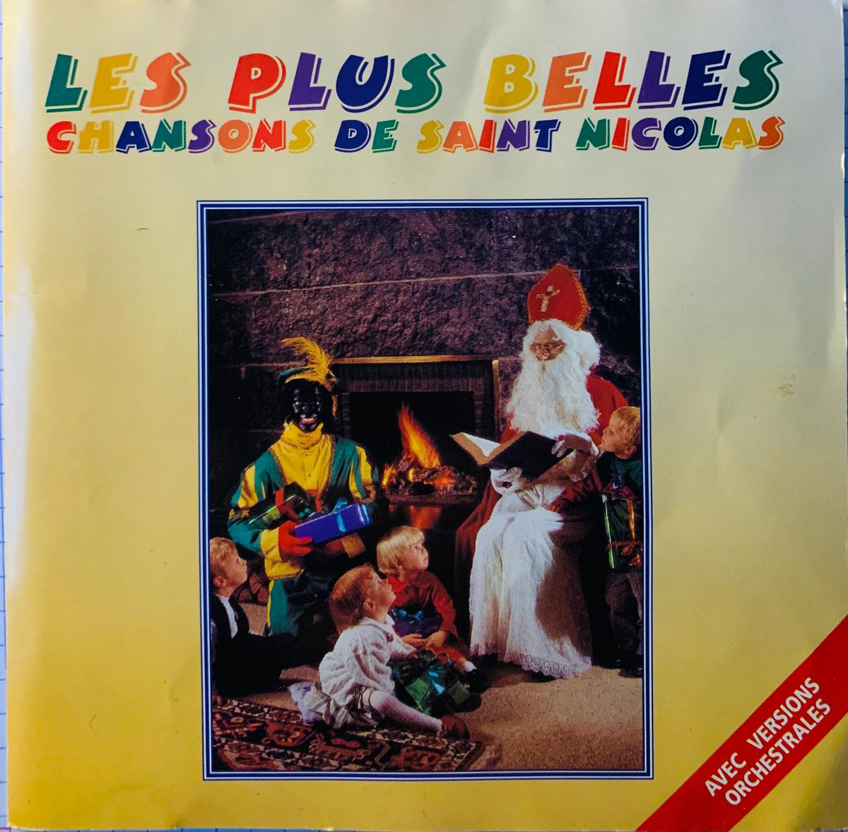 Yellow album cover of various artists les plus belles chansons de saint nicolas with colorful saint nicholas illustration