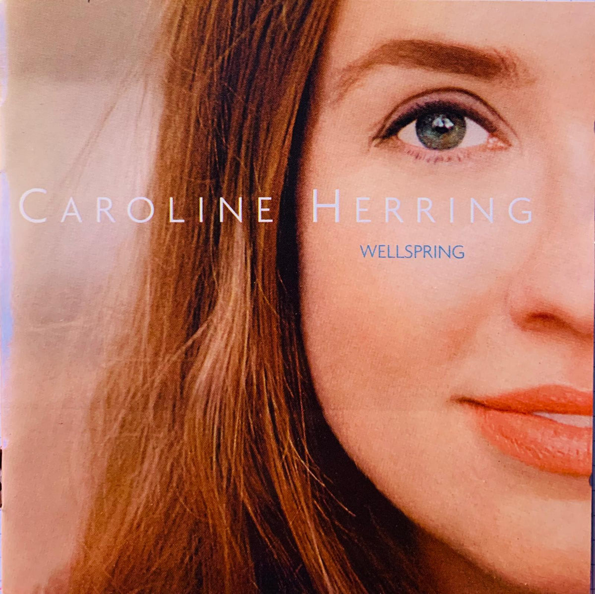 Caroline herring wellspring original cd album cover close-up portrait warm medium-length brown hair soft background