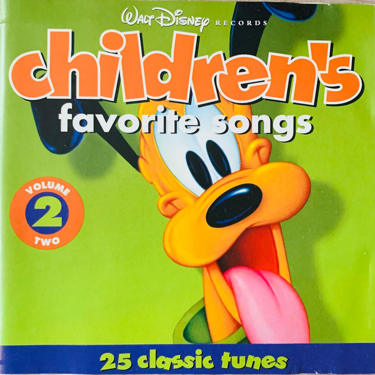 Vibrant green CD album cover featuring a cartoon Pluto with tongue out for Walt Disney children’s favorite songs volume 2
