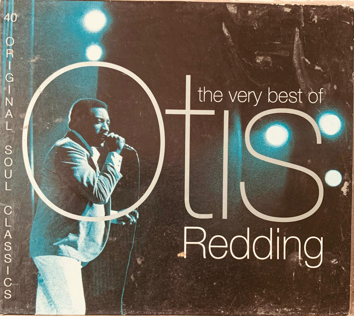 Otis Redding the very best of original CD album cover with black and white photo teal lighting and white text on dark background