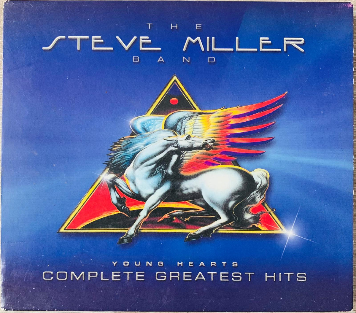 The steve miller band cd young hearts complete greatest hits features a blue and white winged horse with fiery red-orange wings