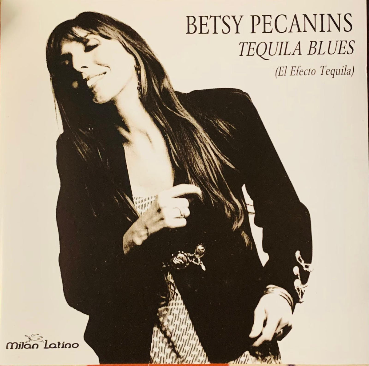 Black-and-white album cover of betsy pecanins in dark blazer with decorative cuffs and belt for tequila blues cd