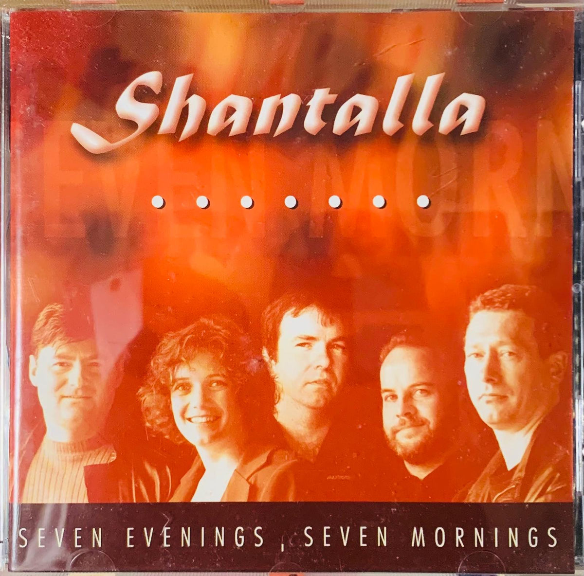 Shantalla seven evenings seven mornings original CD album cover with fiery orange and red gradient background featuring band portraits
