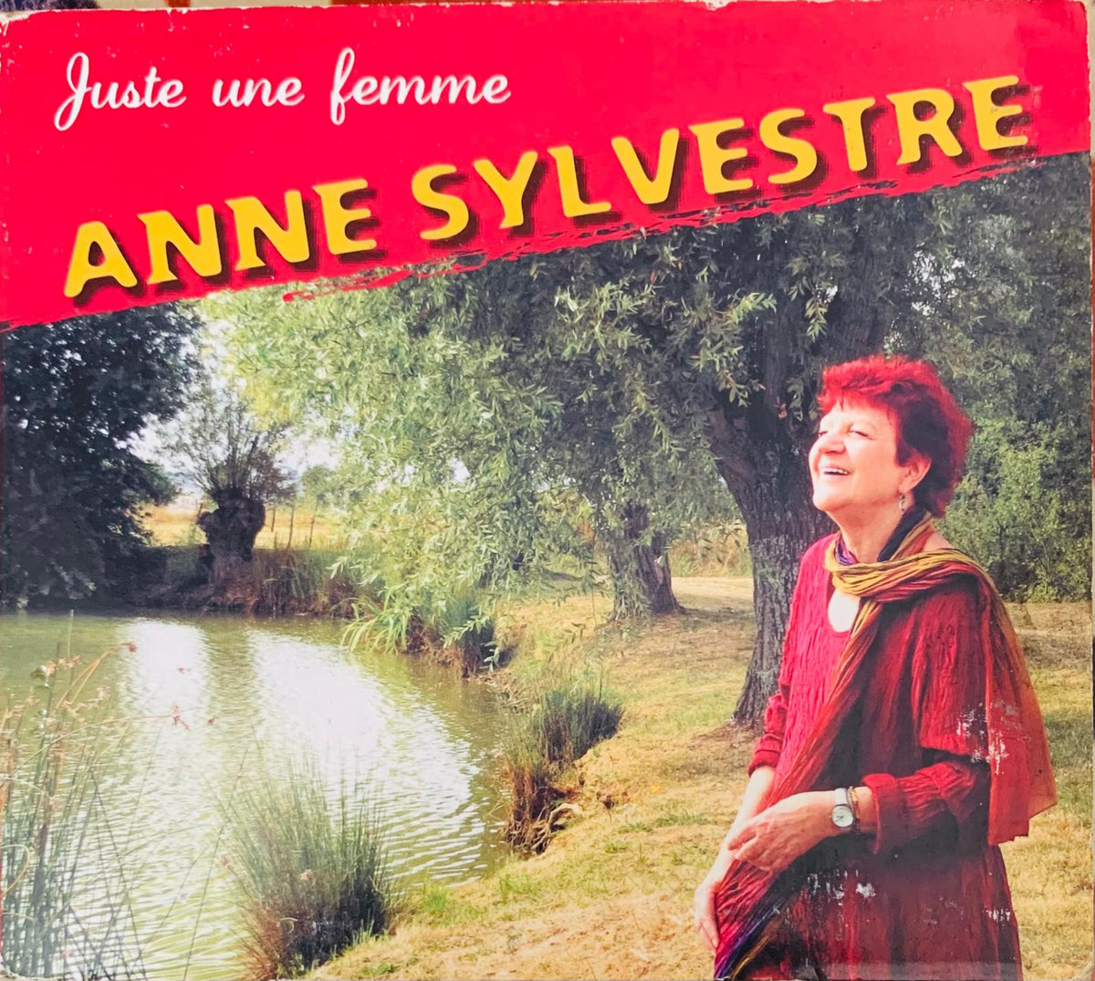 Anne Sylvestre wearing a red textured dress on the original CD album cover for Juste Une Femme