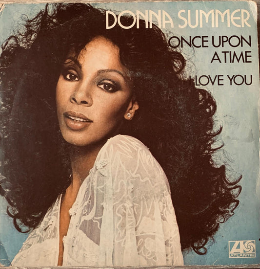 Donna Summer once upon a time 45 rpm vinyl record sleeve featuring her in a white lace top on light blue background