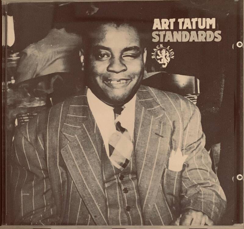 Black and white album cover of Art Tatum in pinstripe suit titled Art Tatum standards by Black Lion Records on CD
