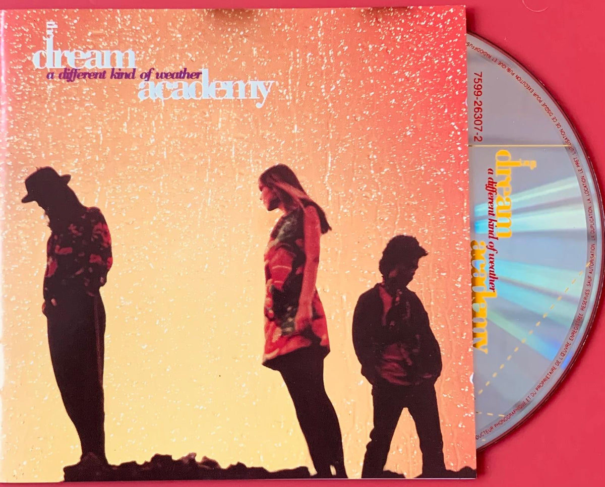The dream academy a different kind of weather 1990 original cd with vibrant orange yellow gradient and silhouetted figures