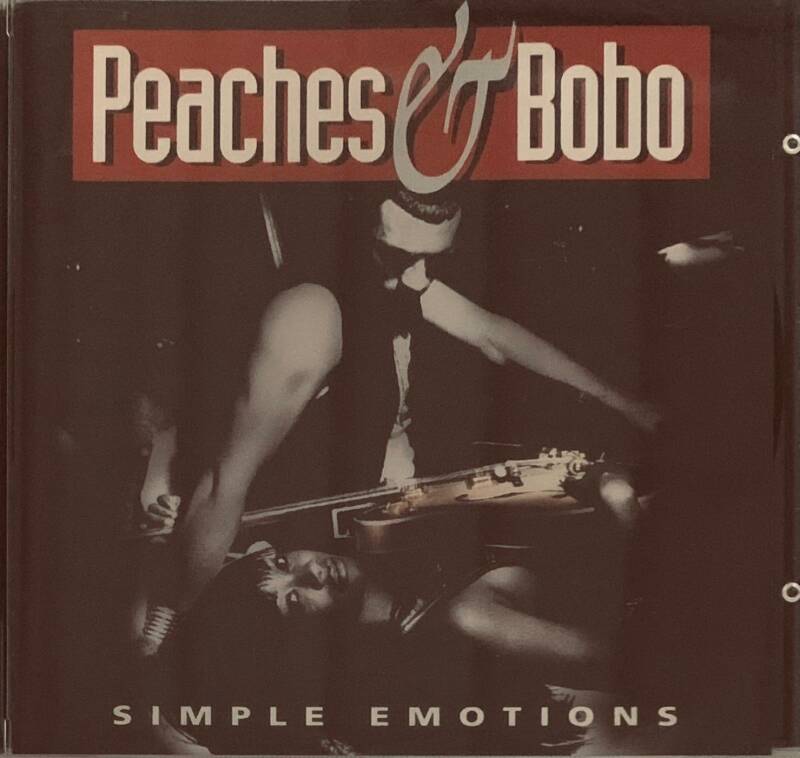 The album cover for peaches & bobo simple emotions cd features a black and white photo of two musicians in motion