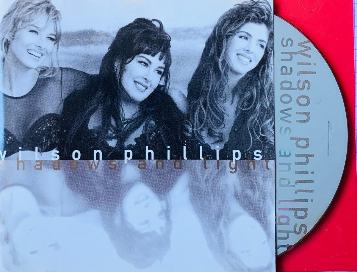 The album Shadows and Light by Wilson Phillips features a monochrome photo of the three members on the cover