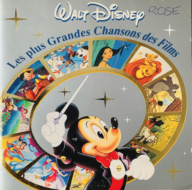 Walt Disney rose album CD cover with Mickey Mouse in a conductor outfit and colorful Disney movie character scenes