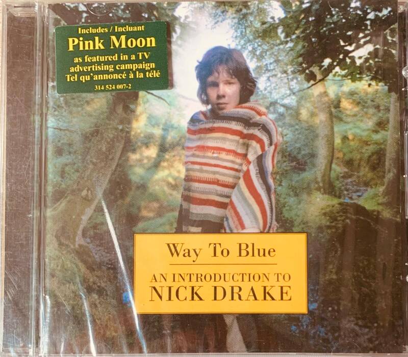 The album cover for way to blue an introduction to nick drake features a young man in a red white and gray striped sweater outdoors