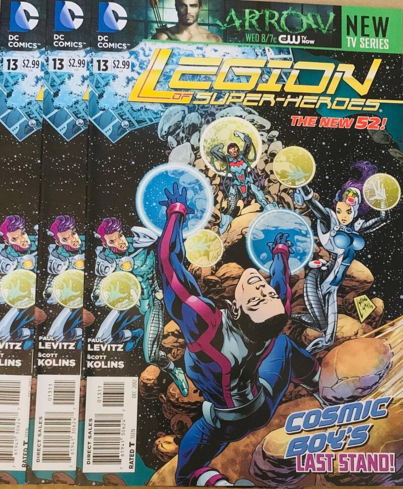 Legion of super-heroes the new 52 #13 comic book with cosmic artwork featuring characters in blue and purple suits